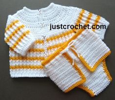 two white and yellow knitted sweaters sitting next to each other