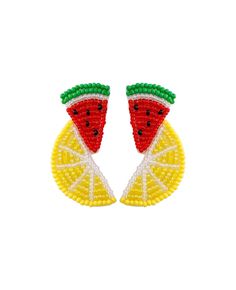 two pieces of fruit with beads on them, one slice of watermelon and the other piece of lemon