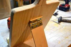 a close up of a wooden object on a workbench