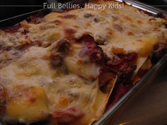 a casserole dish with cheese and meat in it