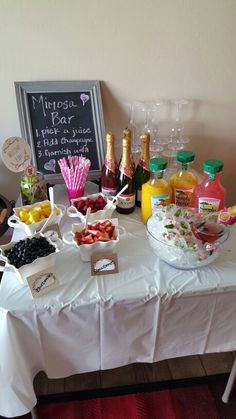 a table topped with lots of different types of food and drinks on top of it