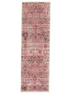 a pink rug with an ornate design on it