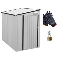 a small storage shed with gloves next to it