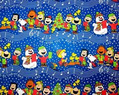 a blue christmas fabric with cartoon characters on it