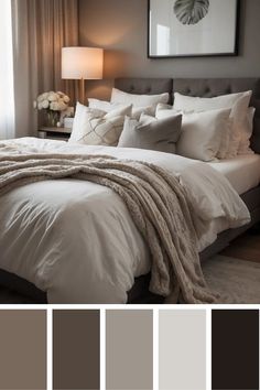 a bedroom with gray walls, white bedding and neutrals in the color scheme