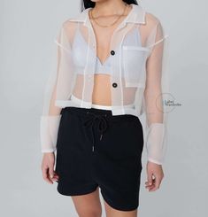 Sheer Organza Jacket Overlay Shirt Blouse. Transparent Jacket sheer jacket Style Blouse. Cropped Blouse.Women's Casual Shirt  XS----BUST:- 32, WAIST:-24, HIP:-34 S----BUST:- 34, WAIST:-26, HIP:-36 M----BUST:- 36, WAIST:-28, HIP:-38 L----BUST:- 38, WAIST:-30, HIP:-40 XL----BUST:- 40, WAIST:-32, HIP:-42 XXL----BUST:- 42, WAIST:-34, HIP:-44 𝐂𝐚𝐫𝐞 𝐈𝐧𝐬𝐭𝐫𝐮𝐜𝐭𝐢𝐨𝐧𝐬: *Dry Clean only *Do not soak in water 𝐍𝐨𝐭𝐞: 𝐏𝐫𝐨𝐝𝐮𝐜𝐭 𝐜𝐨𝐥𝐨𝐮𝐫 𝐦𝐚𝐲 𝐬𝐥𝐢𝐠𝐡𝐭𝐥𝐲 𝐯𝐚𝐫𝐲 𝐝𝐮𝐞 𝐭𝐨 𝐩𝐡 Organza Tops Blouses, Jacket Style Blouse, Transparent Jacket, Organza Jacket, Poncho Style Top, Sheer Jacket, Organza Shirt, Organza Top, Cropped Blouse