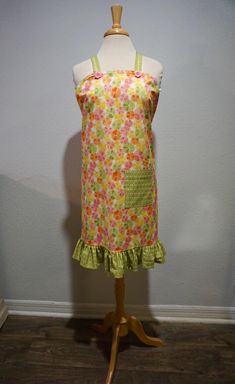 a dress on a mannequin in front of a wall