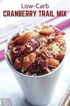 a white bowl filled with cranberry trail mix