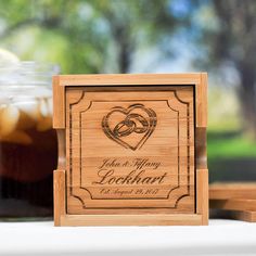 personalized wooden coaster with two hearts on the front and back, engraved in wood