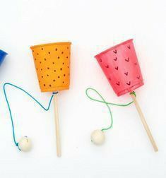 three different types of toothpicks with string attached to them on a white surface