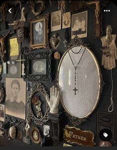 a wall covered in pictures and other items on it's side, including an ornate mirror