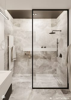 a modern bathroom with marble walls and floor