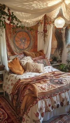 a bed with lots of pillows and blankets on top of it