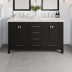 a bathroom with two sinks and mirrors on the wall