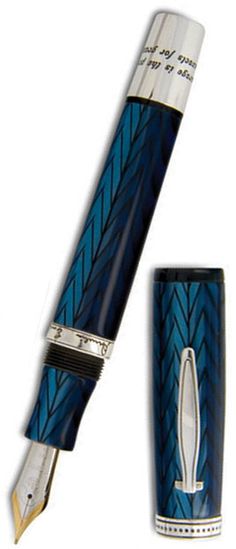 a blue and silver fountain pen sitting on top of a white surface