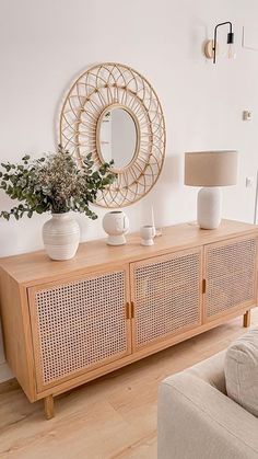 a living room with a couch, table and mirror