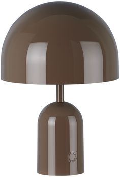 a brown table lamp sitting on top of a white floor