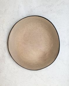 a brown plate sitting on top of a white counter