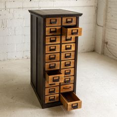 a tall cabinet with many drawers in it