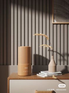 an image of a table with a vase on it and books in front of it