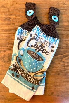 two oven mitts made to look like they have coffee cups on top of them