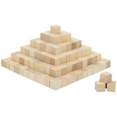 several wooden blocks stacked on top of each other in the shape of a pyramid, with one block missing