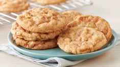 some cookies are stacked on a blue plate