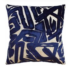 a blue and white pillow with graffiti on it