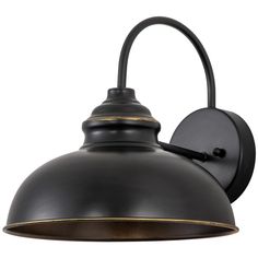 an outdoor wall light with a black shade