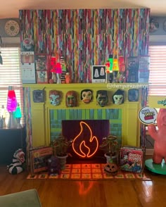 a living room filled with furniture and a fire place covered in neon lights next to a window