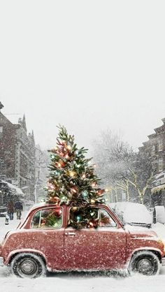 a small red car with a christmas tree on top