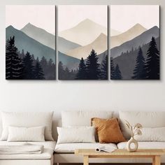 three paintings on the wall in a living room