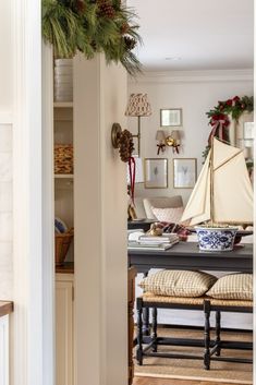 a living room filled with furniture and christmas decorations