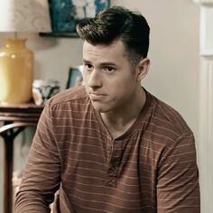 a man sitting in front of a laptop computer