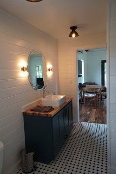 the bathroom is clean and ready to be used as a dining room or family room