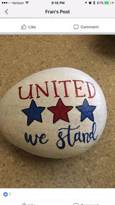 a rock with the words united we stand painted on it and stars in red white and blue