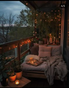 a balcony with lights and pillows on it