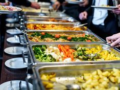 a buffet line with many different types of food