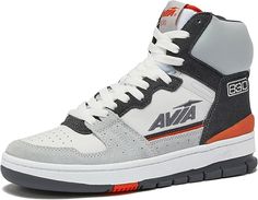 a white and grey shoe with orange accents