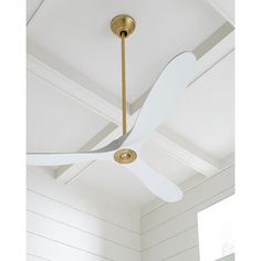 a white ceiling fan in a room