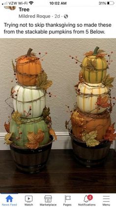 three pumpkins are stacked on top of each other