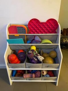 a shelf filled with lots of different types of toys