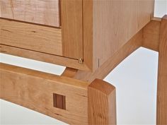 a close up view of a wooden bed frame