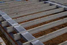 the inside of a building being constructed with concrete blocks and cement floor joisting