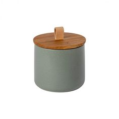 a green container with a wooden lid on a white background