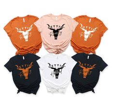 four different styles of tshirts with the words bettiet on them in black, orange and white