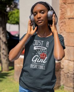 a woman wearing headphones while listening to music