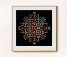 a black and gold framed art print with an ornate design