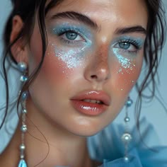 Discover a variety of looks from soft, shimmery eyes to daring azure accents, complemented by flawless skin and the perfect lip shade. Ocean Goddess Makeup, Couture Makeup Looks, Sea Inspired Makeup, Jellyfish Inspired Makeup, Water Nymph Makeup, Blue Pearl Makeup, Poseidon Makeup, Lagoona Blue Makeup, Seahorse Makeup