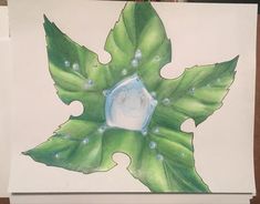 a drawing of a green leaf with water drops on it and a white square in the center